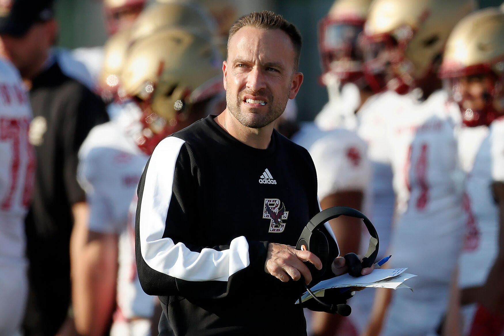 Boston College head coach Jeff Hafley stands on the field during a timeou